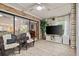 Outdoor lanai with tile flooring, ceiling fan, and view to the backyard at 912 Fruitwood Pl, Port Orange, FL 32127