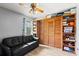 Relaxing living room featuring a couch and closet at 912 Fruitwood Pl, Port Orange, FL 32127