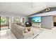 Spacious living room with comfortable seating and sliding doors leading to the outdoor space at 912 Fruitwood Pl, Port Orange, FL 32127