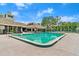 Community pool featuring crystal-clear water, lounge chairs, and shaded cabanas, perfect for relaxation and recreation at 912 Fruitwood Pl, Port Orange, FL 32127