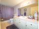Well-lit bathroom featuring a large mirror and vanity at 10031 Sw 62Nd Cir, Ocala, FL 34476