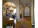 Inviting foyer with tiled floor, arched doorways leading to dining room, and view to the entry door at 10031 Sw 62Nd Cir, Ocala, FL 34476