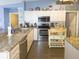 Functional kitchen with stainless steel appliances, granite countertops, and ample cabinet space at 10031 Sw 62Nd Cir, Ocala, FL 34476