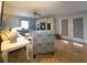 Bright living room with tile flooring, plush seating, and a ceiling fan for comfortable living at 10031 Sw 62Nd Cir, Ocala, FL 34476