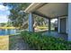 Lush backyard featuring a pond and trees at 117 Hagge Dr, Daytona Beach, FL 32124