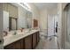 Bright bathroom with a double sink vanity, tiled flooring, and a neutral color scheme at 117 Hagge Dr, Daytona Beach, FL 32124