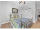 This bedroom features white walls, carpeted floors, a closet door, and a framed picture on the wall at 117 Hagge Dr, Daytona Beach, FL 32124