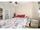 Inviting bedroom with a pull-out couch, a ceiling fan, neutral walls, and access to the rest of the house at 117 Hagge Dr, Daytona Beach, FL 32124