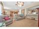 Inviting living room featuring neutral tones, plush seating, and an open layout to the adjacent kitchen at 117 Hagge Dr, Daytona Beach, FL 32124
