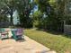 Backyard with a patio dining set and ample green space at 127 Mason Park Dr, Daytona Beach, FL 32117