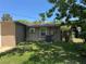 Exterior view of the back of the house and backyard at 127 Mason Park Dr, Daytona Beach, FL 32117