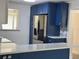 Kitchen with stainless steel refrigerator and custom cabinets with nautical hardware at 127 Mason Park Dr, Daytona Beach, FL 32117