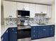 Modern kitchen featuring stainless steel appliances and two-tone cabinets at 127 Mason Park Dr, Daytona Beach, FL 32117