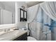 Updated bathroom with modern fixtures, vanity cabinet, stylish shower curtain, and decorative accents at 129 Golden Eye Dr # C, Daytona Beach, FL 32119