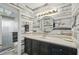 Charming bathroom features shiplap accent wall, modern lighting fixture, and decorative nautical accents at 129 Golden Eye Dr # C, Daytona Beach, FL 32119