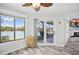 View of the dining area leading out to the enclosed lanai overlooking the lake at 129 Golden Eye Dr # C, Daytona Beach, FL 32119