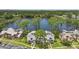 Beautiful lakeside townhome featuring a stunning view, a front yard, and lush landscaping at 129 Golden Eye Dr # C, Daytona Beach, FL 32119