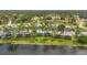 Lovely multi-Gathering units near a lake, showcasing beautiful landscaping and mature trees at 129 Golden Eye Dr # C, Daytona Beach, FL 32119