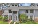 Inviting exterior of a townhome with a well-maintained yard and charming front entrance at 129 Golden Eye Dr # C, Daytona Beach, FL 32119