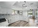 Updated kitchen showcasing white cabinetry, countertop space, and views of the waterway at 129 Golden Eye Dr # C, Daytona Beach, FL 32119