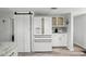 Modern kitchen featuring stainless steel appliances, white cabinets, and convenient pantry at 129 Golden Eye Dr # C, Daytona Beach, FL 32119