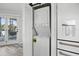 Convenient laundry setup with stackable washer and dryer unit and refrigerator with water dispenser at 129 Golden Eye Dr # C, Daytona Beach, FL 32119