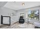 Upstairs living room with a recliner, overlooking the community and stairs with dolphin art at 129 Golden Eye Dr # C, Daytona Beach, FL 32119