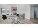 Bright living room features modern furniture, a fireplace, and a view of the water at 129 Golden Eye Dr # C, Daytona Beach, FL 32119