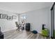 Versatile room featuring hardwood floors, ample natural light, and a functional desk for remote work at 129 Golden Eye Dr # C, Daytona Beach, FL 32119