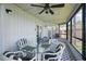 Enclosed patio with serene lake views and comfortable seating, perfect for dining al fresco at 129 Golden Eye Dr # C, Daytona Beach, FL 32119