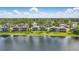 Stunning lakeside residences surrounded by lush trees showcasing idyllic waterfront community at 129 Golden Eye Dr # C, Daytona Beach, FL 32119