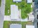 An attractive, high-angle shot showing the house, yard, driveway, and boathouse at 24538 Wildhog Rd, Astor, FL 32102