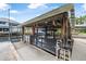Covered boat lift with wood support beams and a protective screen, offering secure boat storage and access to the water at 24538 Wildhog Rd, Astor, FL 32102