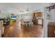 Open-concept living space with laminate flooring, comfortable seating, and natural light at 24538 Wildhog Rd, Astor, FL 32102