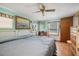 Relaxing bedroom features a cozy bed, ample natural light, and comfortable furnishings at 24538 Wildhog Rd, Astor, FL 32102