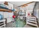 Versatile storage area featuring shelving, stairs, and a partial view of the laundry room, providing organizational solutions at 24538 Wildhog Rd, Astor, FL 32102