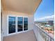 A balcony view with sliding glass doors and metal railing with views of city at 2937 S Atlantic Ave # 2001, Daytona Beach, FL 32118