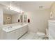 Bright bathroom featuring a double vanity and well-lit mirror at 2937 S Atlantic Ave # 2001, Daytona Beach, FL 32118