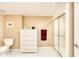Bright bathroom with a glass shower and white dresser at 2937 S Atlantic Ave # 2001, Daytona Beach, FL 32118