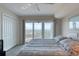Bedroom featuring a ceiling fan, tile floors, and large windows with amazing views at 2937 S Atlantic Ave # 2001, Daytona Beach, FL 32118