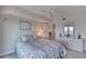 Bedroom with tile floors, ceiling fan, dresser, lamps and a nice view at 2937 S Atlantic Ave # 2001, Daytona Beach, FL 32118