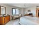 Bright bedroom with dresser, desk and views of the ocean at 2937 S Atlantic Ave # 2001, Daytona Beach, FL 32118