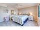 Bedroom with tile floors, lamps, dresser and a window overlooking the city at 2937 S Atlantic Ave # 2001, Daytona Beach, FL 32118