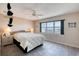 Bedroom with tile floors, lamps and a window overlooking the city and ocean at 2937 S Atlantic Ave # 2001, Daytona Beach, FL 32118