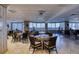 Well-lit dining area with numerous tables and chairs and expansive ocean view at 2937 S Atlantic Ave # 2001, Daytona Beach, FL 32118