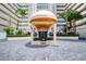 Inviting entrance to condo building with covered awning and beautiful exterior design at 2937 S Atlantic Ave # 2001, Daytona Beach, FL 32118