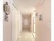 Hallway with bright lighting, tile floors, and a series of closets, offering ample storage space at 2937 S Atlantic Ave # 2001, Daytona Beach, FL 32118
