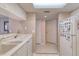 Bright kitchen features white appliances, double sink, and a tile floor at 2937 S Atlantic Ave # 2001, Daytona Beach, FL 32118