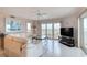 Bright living room with water views, comfortable seating, and television at 2937 S Atlantic Ave # 2001, Daytona Beach, FL 32118