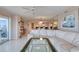 Living room showcasing open floor plan, comfortable sofa, and water views at 2937 S Atlantic Ave # 2001, Daytona Beach, FL 32118